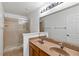 Bathroom featuring a double sink vanity, a large mirror, and a walk-in shower at 2913 Ashford Park Pl, Oviedo, FL 32765