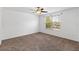 A bedroom featuring carpet flooring, a window, and a ceiling fan with lighting at 2913 Ashford Park Pl, Oviedo, FL 32765