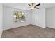 A bedroom featuring carpet flooring, a window with blinds, and a closet at 2913 Ashford Park Pl, Oviedo, FL 32765