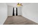 A bedroom featuring carpet flooring, dark curtains, and a ceiling fan with lighting at 2913 Ashford Park Pl, Oviedo, FL 32765