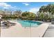 Community pool surrounded by comfortable lounge chairs and lush landscaping at 2913 Ashford Park Pl, Oviedo, FL 32765