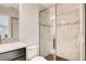 Modern bathroom with a glass-enclosed shower, granite countertop, and sleek fixtures at 3060 Water Clover Ct, Apopka, FL 32712