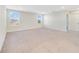 Large bedroom featuring neutral carpet, white walls, and natural light from two sunny windows at 3070 Prelude Ln, Kissimmee, FL 34746