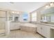 Main bathroom with double vanity, walk-in shower, and soaking tub at 3070 Prelude Ln, Kissimmee, FL 34746