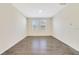 Neutral colored bonus room featuring two windows providing lots of natural light and wood-look tile flooring at 3070 Prelude Ln, Kissimmee, FL 34746