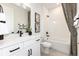 Contemporary bathroom with modern fixtures, white cabinets, and a shower-tub combo at 3235 Legends Preserve Dr, Daytona Beach, FL 32124