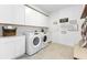 Well-organized laundry room features modern appliances, plenty of storage, and decorative signage at 3235 Legends Preserve Dr, Daytona Beach, FL 32124