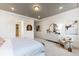 Serene main bedroom featuring tray ceilings, neutral color palette, and ensuite bathroom access at 3235 Legends Preserve Dr, Daytona Beach, FL 32124