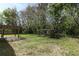 Backyard featuring a covered patio, concrete, wood beams, and grass at 324 Lusitano Way, Sanford, FL 32773