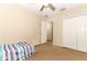 Bedroom featuring carpet, ceiling fan, closet, and window, providing a comfortable space at 324 Lusitano Way, Sanford, FL 32773