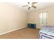 Bedroom with carpet, a ceiling fan, and a window to allow natural light at 324 Lusitano Way, Sanford, FL 32773