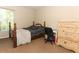 Cozy bedroom with carpet, natural light, desk, and dresser, providing a functional and comfortable space at 324 Lusitano Way, Sanford, FL 32773