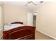 Bedroom featuring a wood-frame bed and neutral decor at 324 Lusitano Way, Sanford, FL 32773