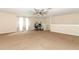 Large bonus room with high ceilings, plush carpeting, and abundant natural light at 324 Lusitano Way, Sanford, FL 32773