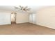 Open and spacious bonus room with plush carpeting, and a stylish ceiling fan at 324 Lusitano Way, Sanford, FL 32773