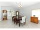 Bright dining room featuring tile floors, and a large window offering ample natural light at 324 Lusitano Way, Sanford, FL 32773