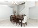 Open-concept dining room area with tile flooring and a stairway leading to a second floor at 324 Lusitano Way, Sanford, FL 32773