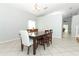 Spacious dining area features neutral walls, tile flooring, and modern lighting fixtures at 324 Lusitano Way, Sanford, FL 32773