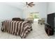 Spacious living room with a fan, neutral paint, tile floors and a sliding glass door at 324 Lusitano Way, Sanford, FL 32773