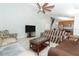 Spacious living room area with a view into the eat-in kitchen and stairs to the second floor at 324 Lusitano Way, Sanford, FL 32773