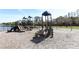 Community playground with slides and swing set overlooking the lake in a beautiful setting at 324 Lusitano Way, Sanford, FL 32773