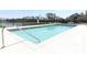 Community swimming pool with clear water, lounge chairs, and a nearby playground at 324 Lusitano Way, Sanford, FL 32773