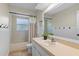 Bright bathroom with a bathtub, shower, and large mirror over a white vanity at 33639 Wesley Rd, Eustis, FL 32736