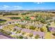 Overhead neighborhood shot features community clubhouse, pool, green spaces and surrounding homes at 3618 Solana Cir, Clermont, FL 34711