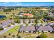 Aerial shot highlighting a home's location within a community, near amenities and green spaces at 3618 Solana Cir, Clermont, FL 34711