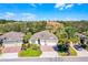 Aerial view of the home's exterior, roof, and nearby landscaping at 3618 Solana Cir, Clermont, FL 34711