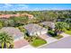 Beautiful aerial view of a home with a red brick driveway and well-maintained landscaping at 3618 Solana Cir, Clermont, FL 34711