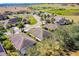 Scenic aerial shot showing the rooftops of homes in a neighborhood with mature trees and green spaces at 3618 Solana Cir, Clermont, FL 34711