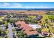 Wide aerial shot of community pool and clubhouse and some of the homes in the neighborhood at 3618 Solana Cir, Clermont, FL 34711