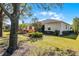 Well-kept backyard with a combination of lawn and shrubbery at 3618 Solana Cir, Clermont, FL 34711