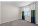 Neutral bedroom featuring large window with stylish curtains and plush carpeting at 3618 Solana Cir, Clermont, FL 34711