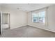 Bedroom with doorway to another room and a large window at 3618 Solana Cir, Clermont, FL 34711