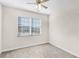 Cozy bedroom with a ceiling fan and a window that offers natural light at 3618 Solana Cir, Clermont, FL 34711