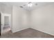 Bedroom with ceiling fan and adjacent door to another room at 3618 Solana Cir, Clermont, FL 34711