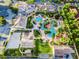 Aerial view of community featuring a large pool area, volleyball court, and ample parking at 3653 Calabria Ave, Davenport, FL 33897