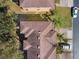 Aerial view of a home's roof showing architectural details and overall property layout in a residential neighborhood at 3653 Calabria Ave, Davenport, FL 33897