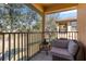 Comfortable balcony featuring seating and views of the greenery nearby at 3653 Calabria Ave, Davenport, FL 33897