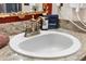 Close up of a bathroom sink with granite countertop, bronze fixtures, and neutral decor at 3653 Calabria Ave, Davenport, FL 33897