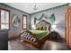 Unique bedroom with castle-themed wallpaper, hardwood floors, and a decorative chandelier at 3653 Calabria Ave, Davenport, FL 33897