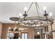 Close-up of elegant chandeliers hanging from the ceiling of the dining room at 3653 Calabria Ave, Davenport, FL 33897