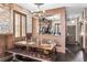 Dining room with rustic-style dining set and a view of the kitchen and front door at 3653 Calabria Ave, Davenport, FL 33897