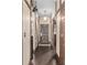 Hallway with hardwood floors and detailed trim leads to the front door at 3653 Calabria Ave, Davenport, FL 33897