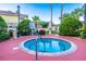 Relaxing hot tub area surrounded by lush landscaping, offering a private and tranquil retreat for residents at 3653 Calabria Ave, Davenport, FL 33897