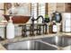 Close-up of a kitchen sink with granite countertop and bronze fixtures at 3653 Calabria Ave, Davenport, FL 33897