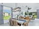 Dining area connected to the living room, featuring stylish furnishings and ample natural light at 366 Wayland Dr, Haines City, FL 33844