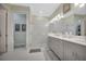 Contemporary bathroom featuring a double vanity, and a glass-enclosed shower at 3704 Via Monte Napoleone Dr, Poinciana, FL 34759